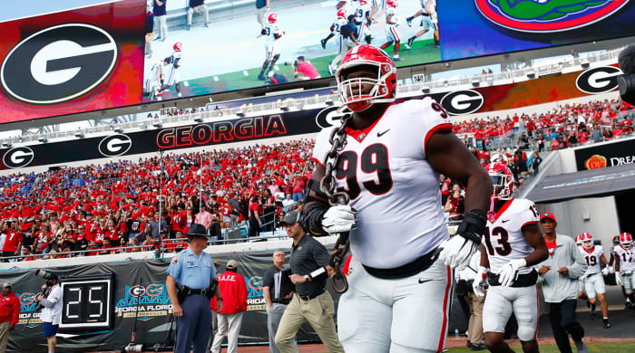 Georgia Bulldogs defensive lineman Jordan Davis runs out of the tunnel
